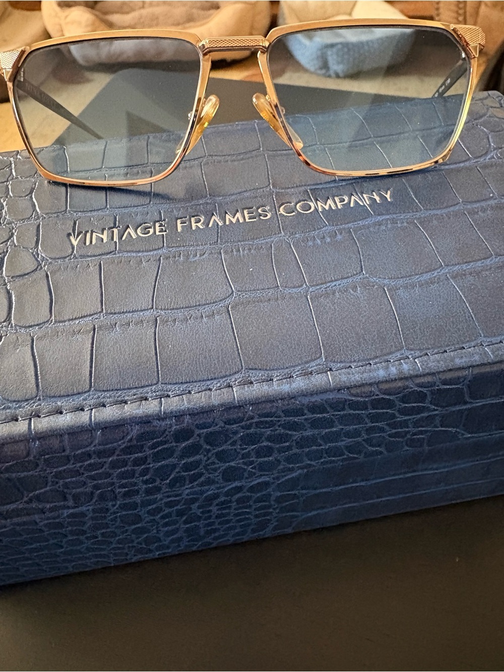 Nina Ricci Blue-Tinted Lens Gold Frame Sunglasses